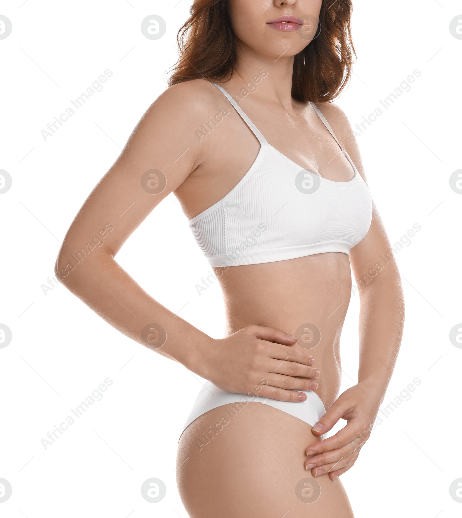 Photo of Woman with slim body posing on white background, closeup