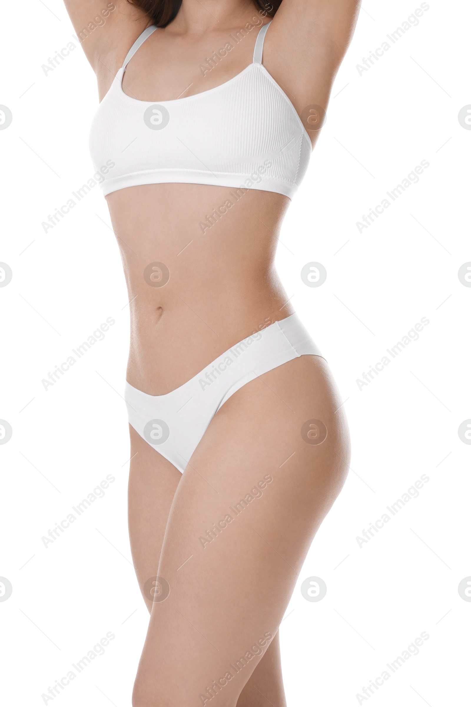 Photo of Woman with slim body posing on white background, closeup