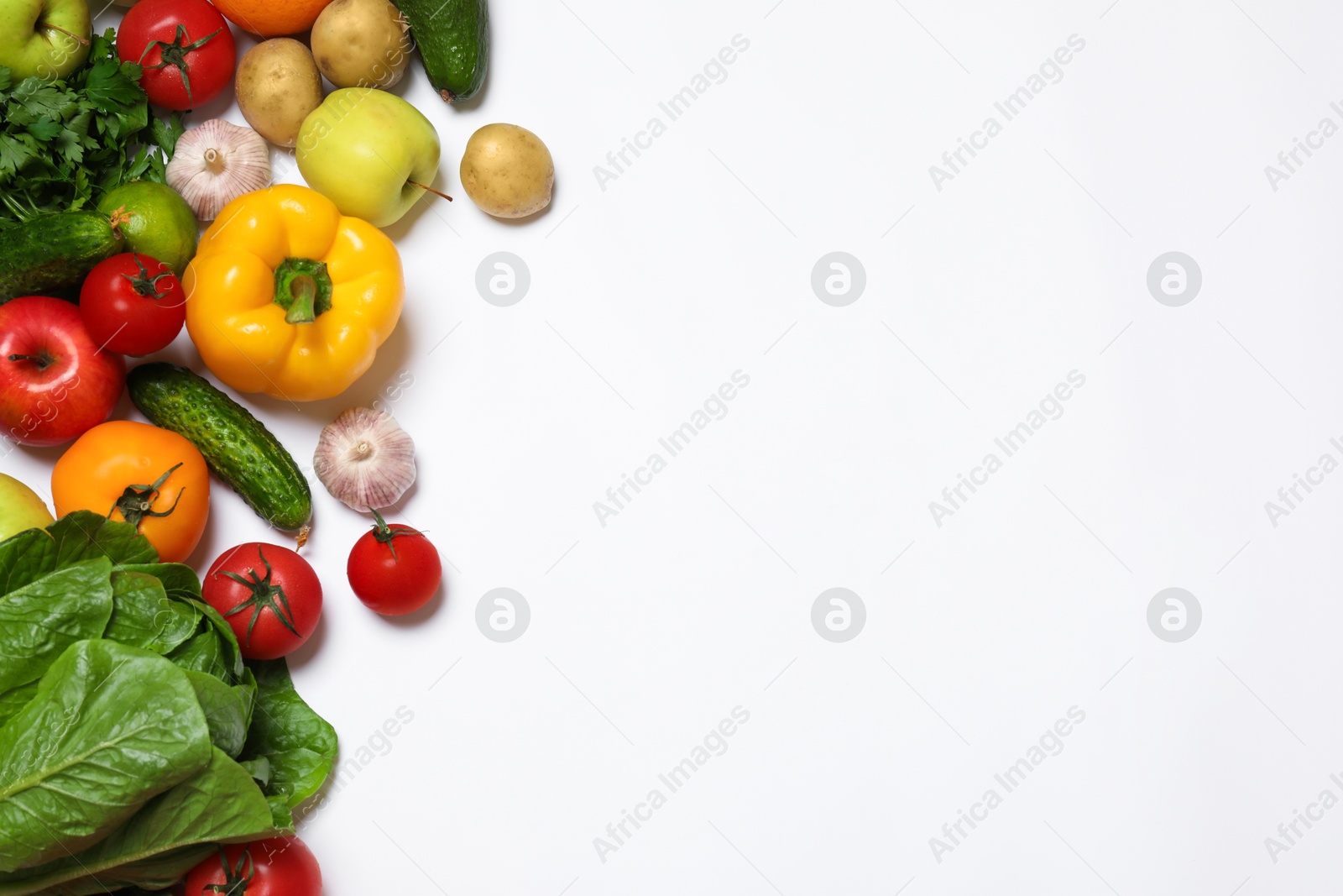 Photo of Healthy vegetarian food. Different vegetables and fruits on white background, flat lay. Space for text