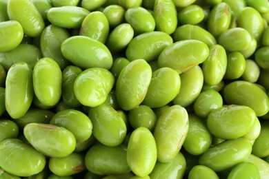 Photo of Raw green edamame soybeans as background, closeup