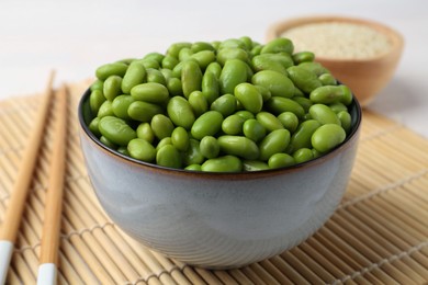 Fresh edamame soybeans in bowl on table, closeup