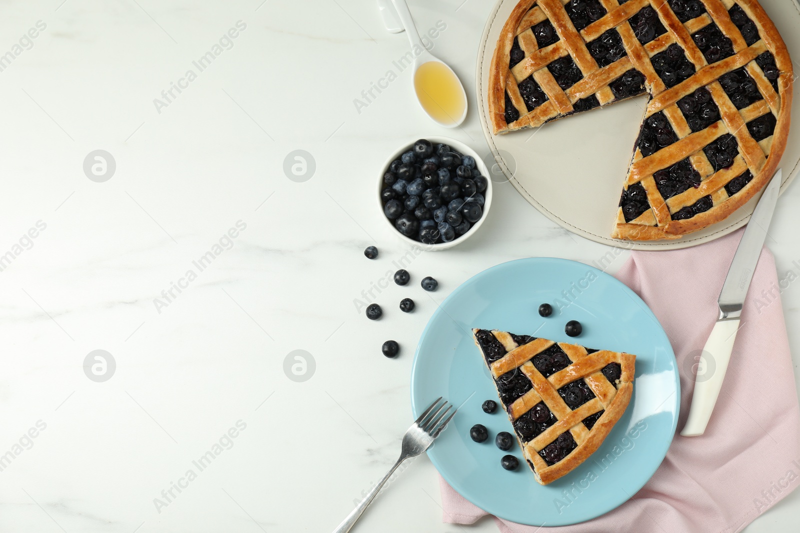 Photo of Tasty homemade pie with blueberries served on white marble table, flat lay. Space for text