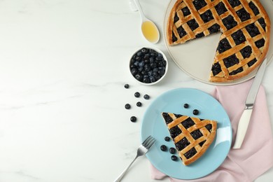 Photo of Tasty homemade pie with blueberries served on white marble table, flat lay. Space for text