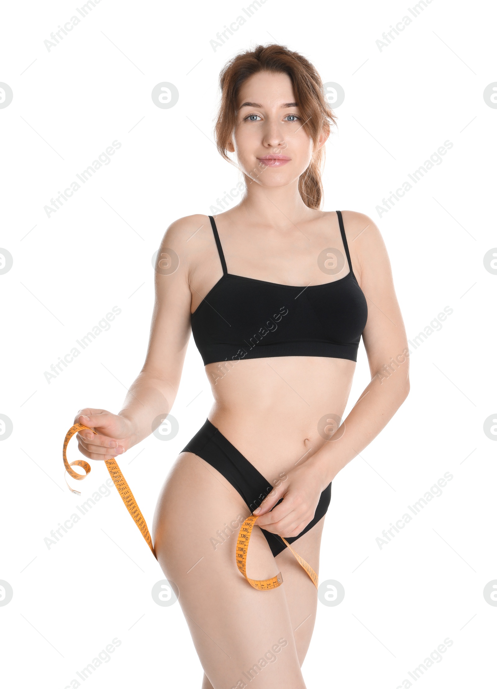 Photo of Woman with measuring tape showing her slim body against white background