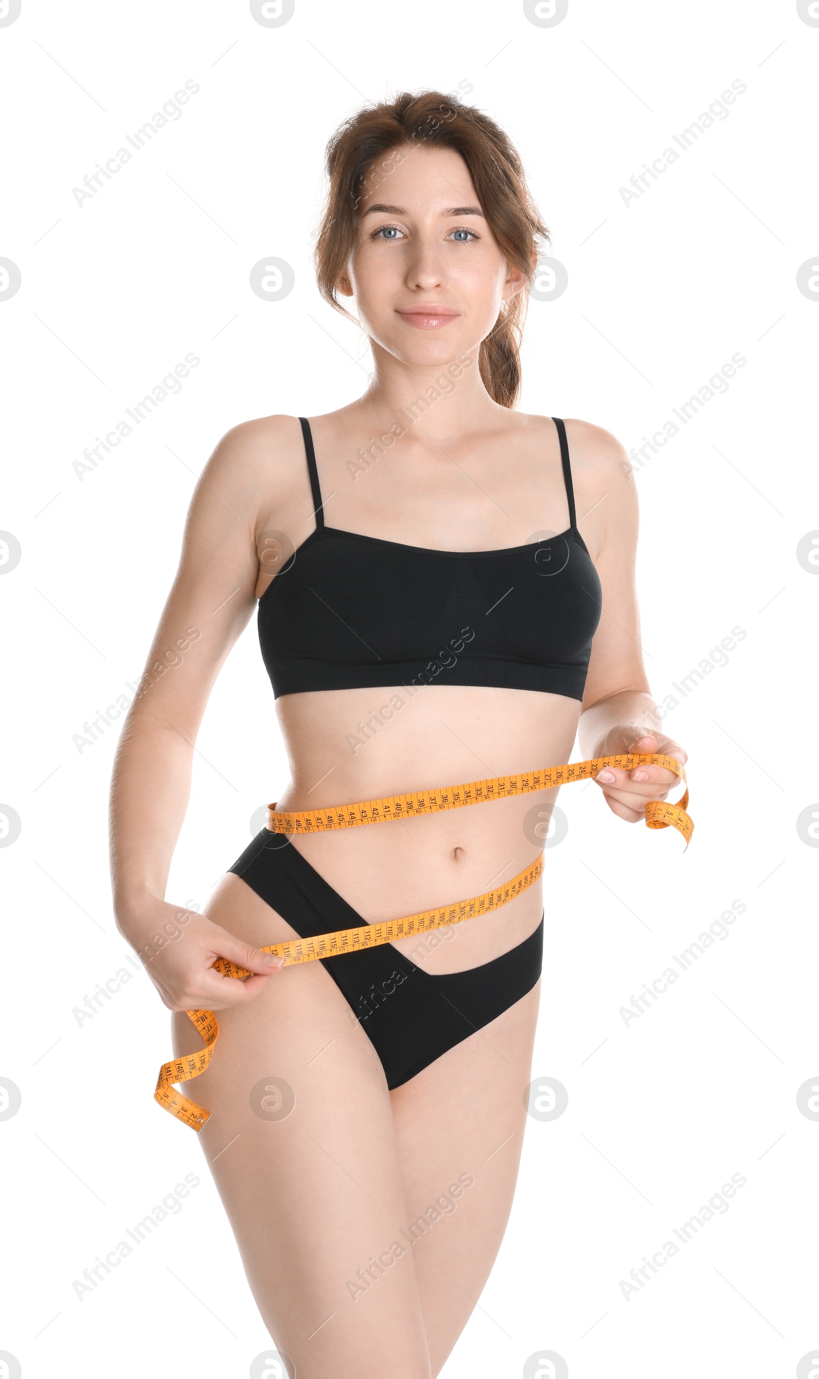 Photo of Woman with measuring tape showing her slim body against white background