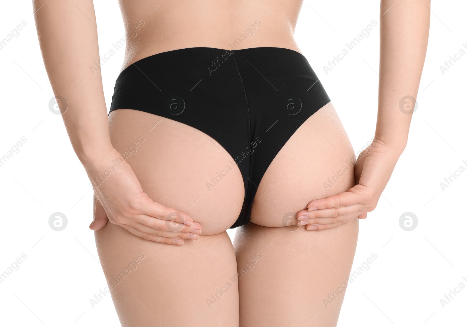 Photo of Woman in black panties showing her slim body on white background, closeup