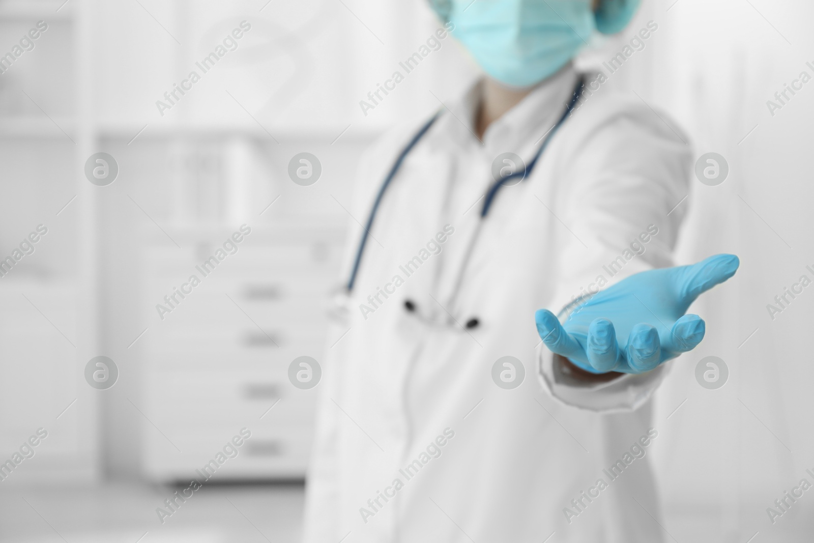 Photo of Doctor holding something in clinic, closeup view. Space for text