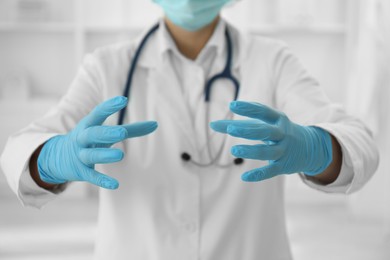 Photo of Doctor holding something in clinic, closeup view