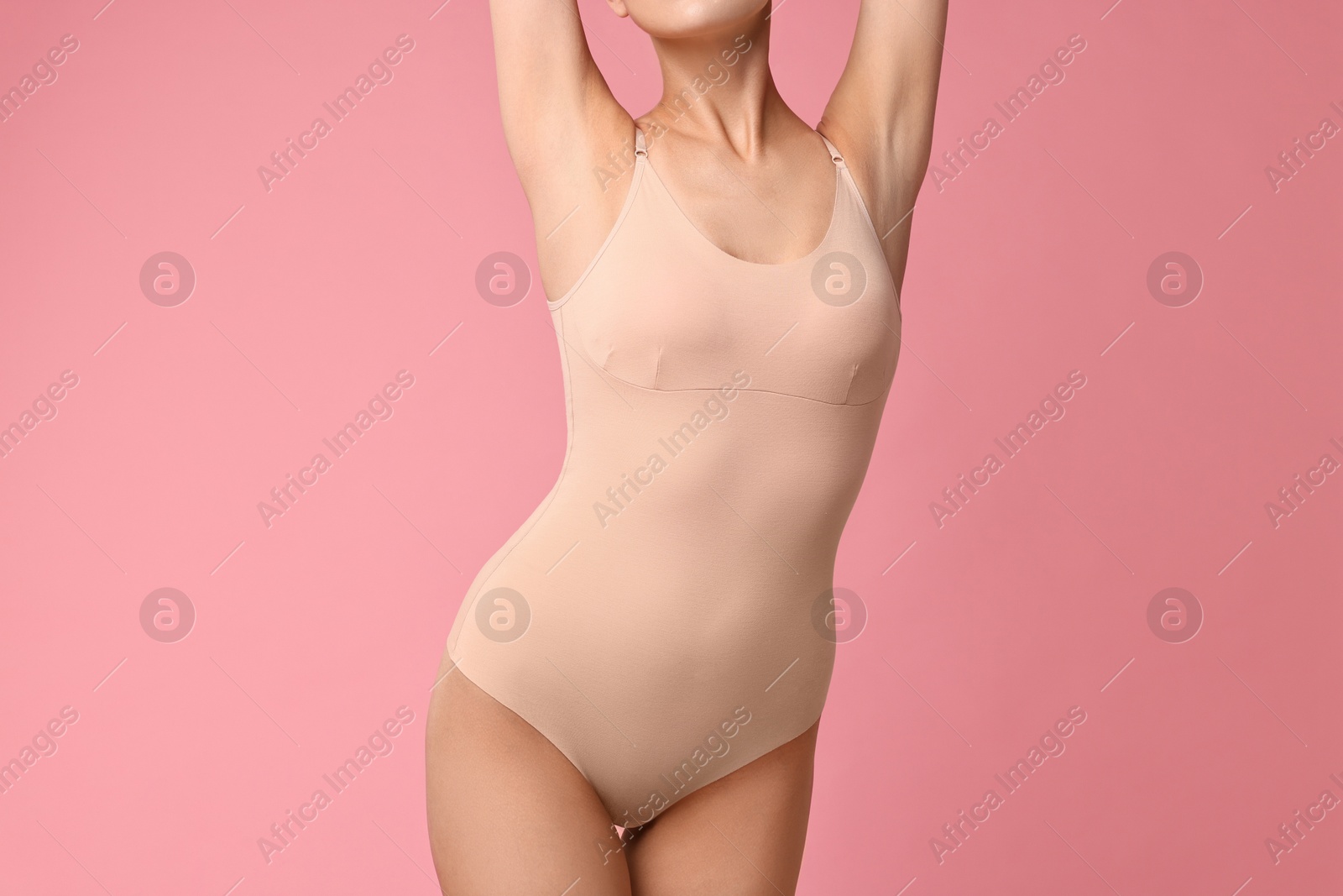 Photo of Woman with perfect skin on pink background, closeup. Body care