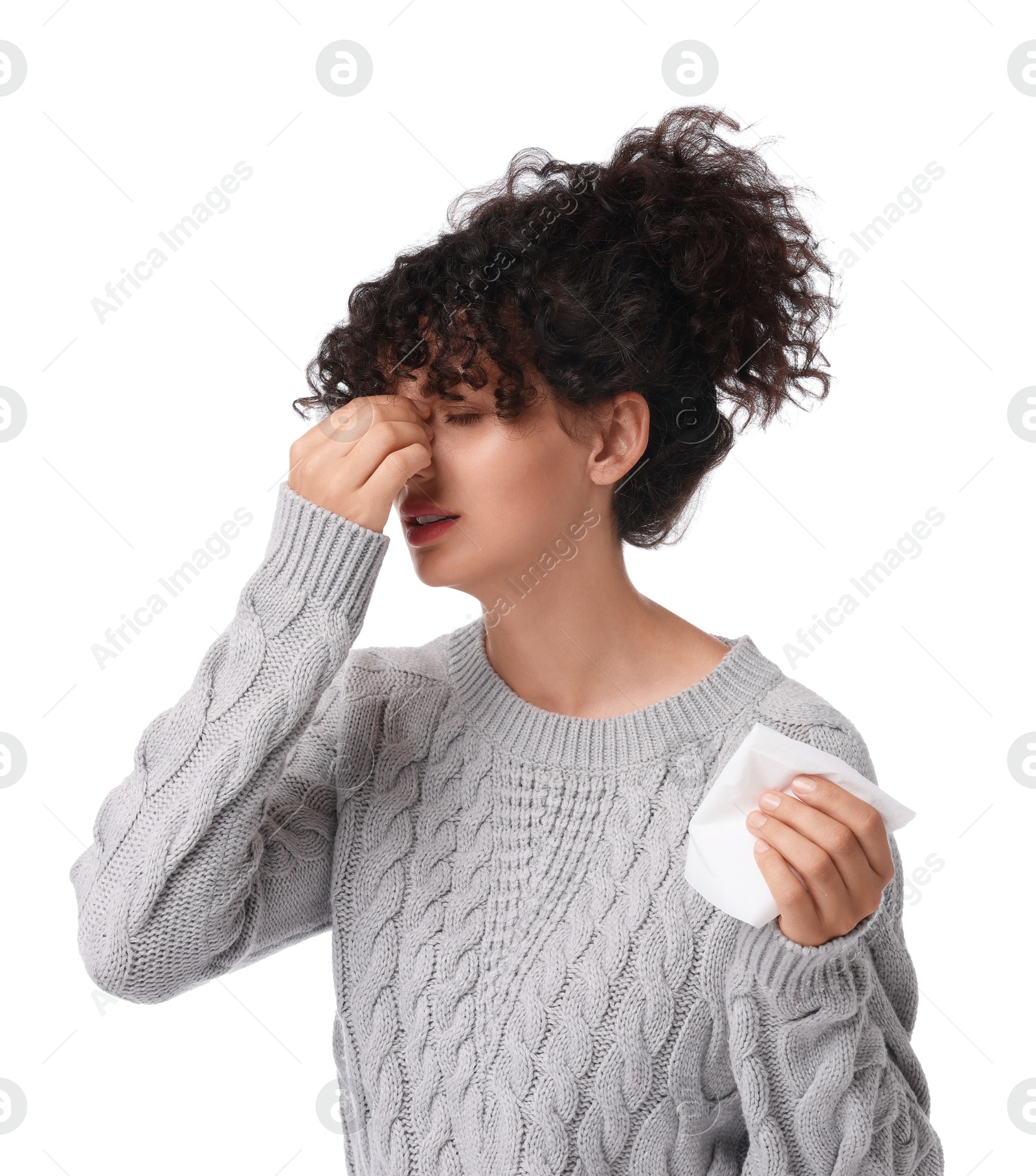 Photo of Cold symptom. Young woman with tissue on white background