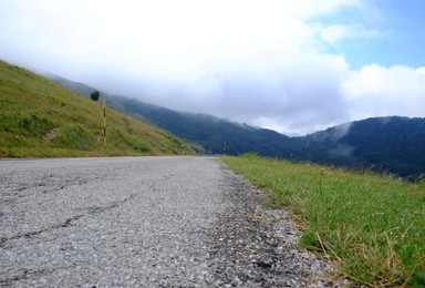 Picturesque view of green forest and road in mountains