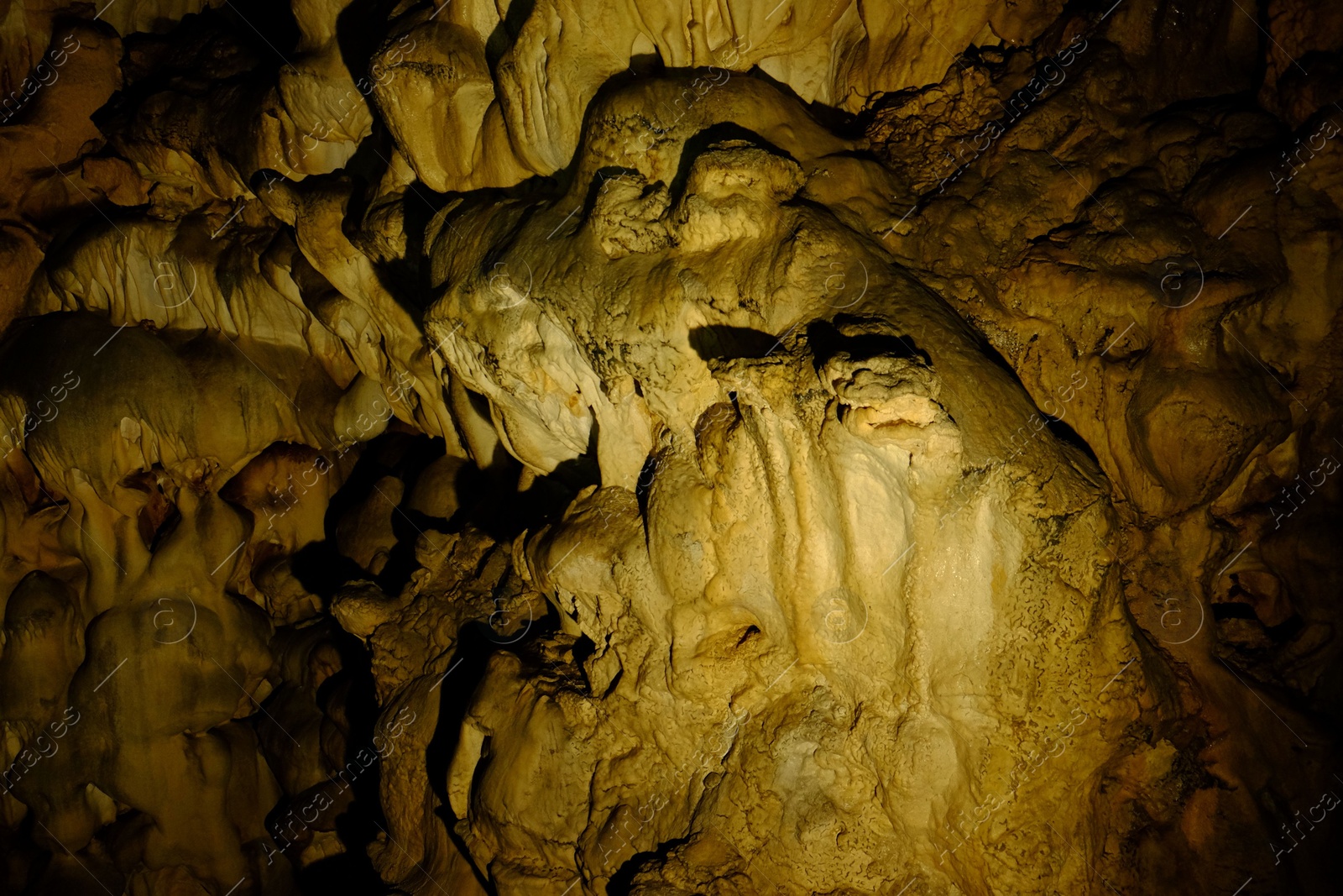 Photo of View of rock formations in dark cave