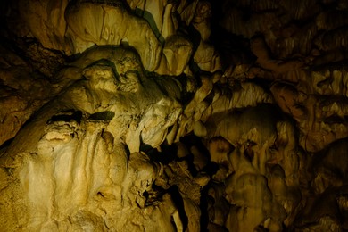 Photo of View of rock formations in dark cave