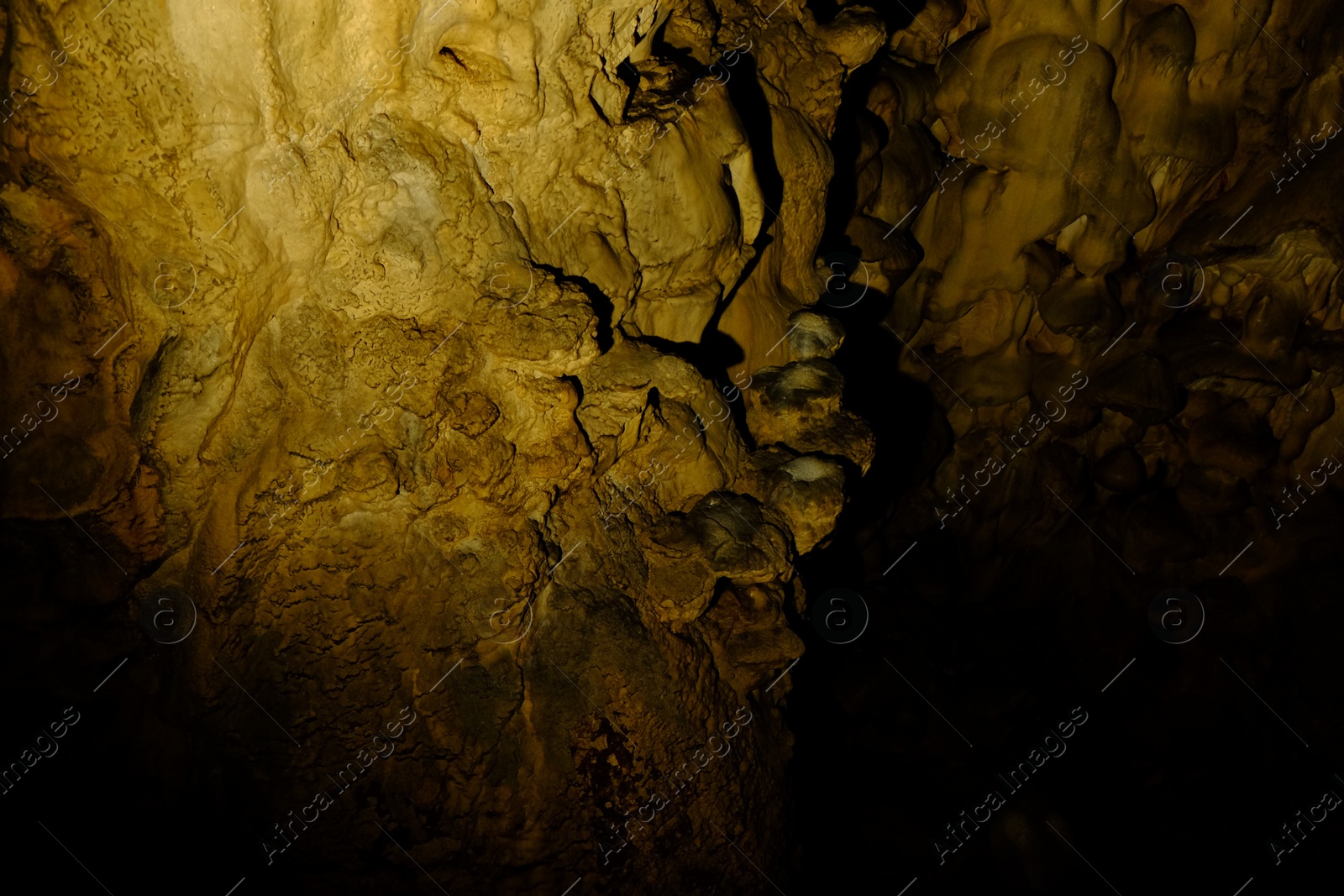 Photo of View of rock formations in dark cave