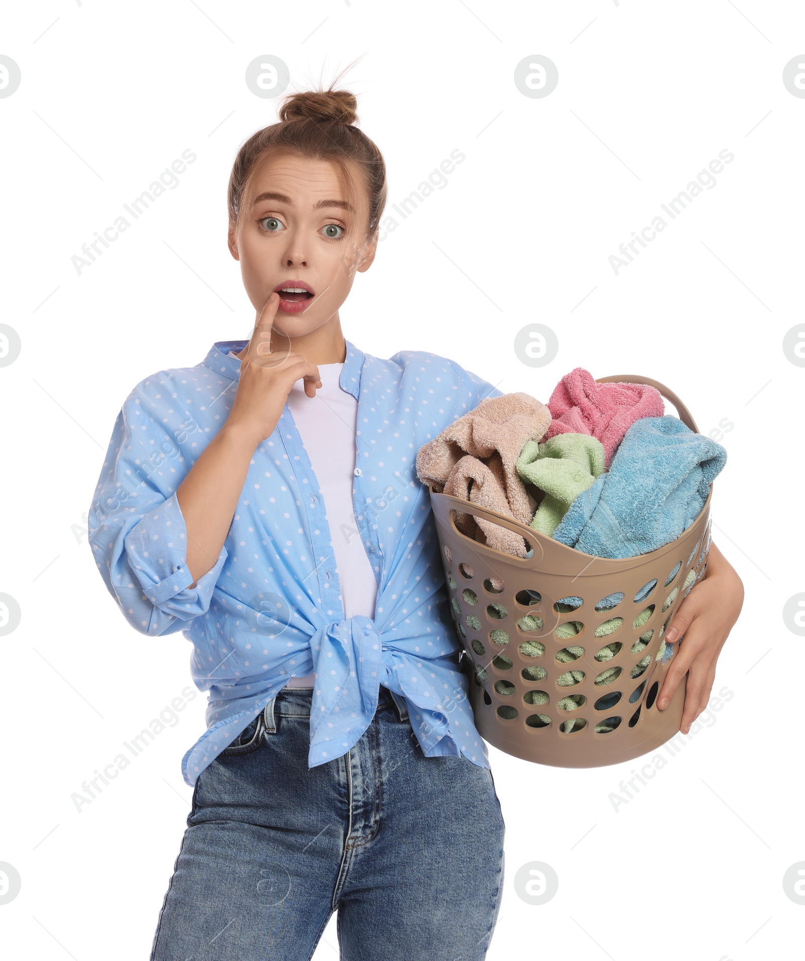 Photo of Emotional housewife with basket full of laundry on white background