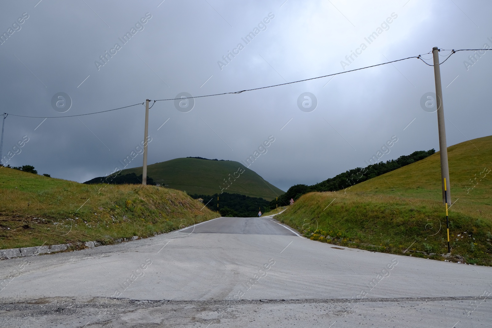 Photo of Picturesque view of green forest and road in mountains