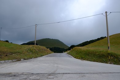 Picturesque view of green forest and road in mountains