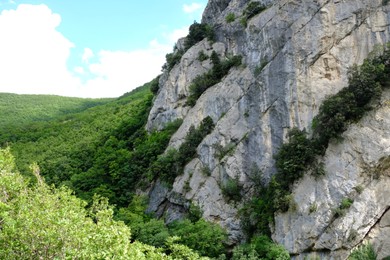 Photo of Picturesque view of rocky cliff in mountains