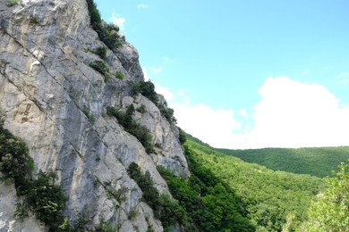 Photo of Picturesque view of rocky cliff in mountains