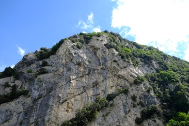 Photo of Picturesque view of rocky cliff against blue sky