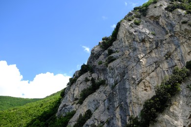 Photo of Picturesque view of rocky cliff in mountains