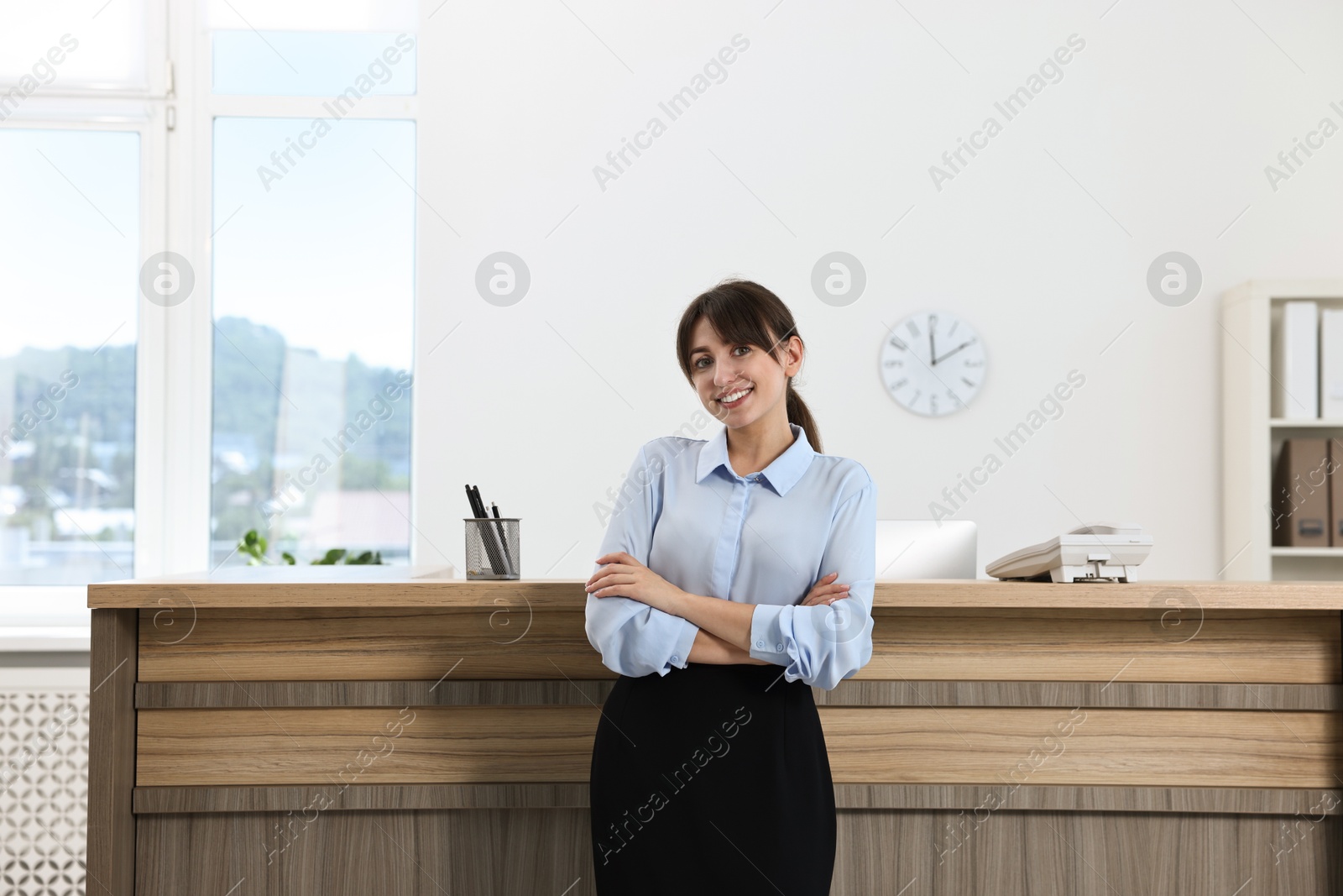 Photo of Portrait of professional receptionist in modern office