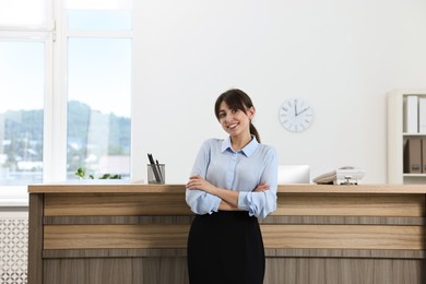 Portrait of professional receptionist in modern office