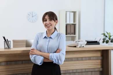 Photo of Portrait of professional receptionist in modern office