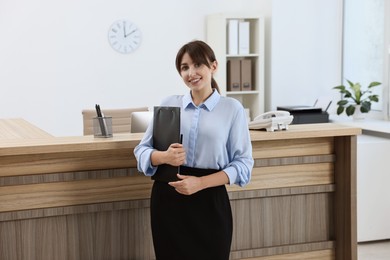 Photo of Portrait of professional receptionist in modern office