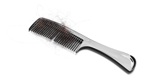 Photo of One comb with lost hair isolated on white