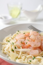 Photo of Delicious pasta with shrimps and cheese on table, closeup