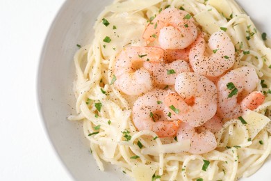 Photo of Delicious pasta with shrimps and cheese on white table, top view