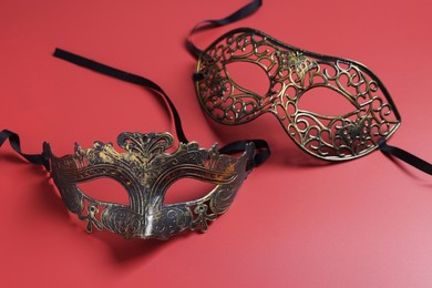 Two beautiful carnival masks on red background