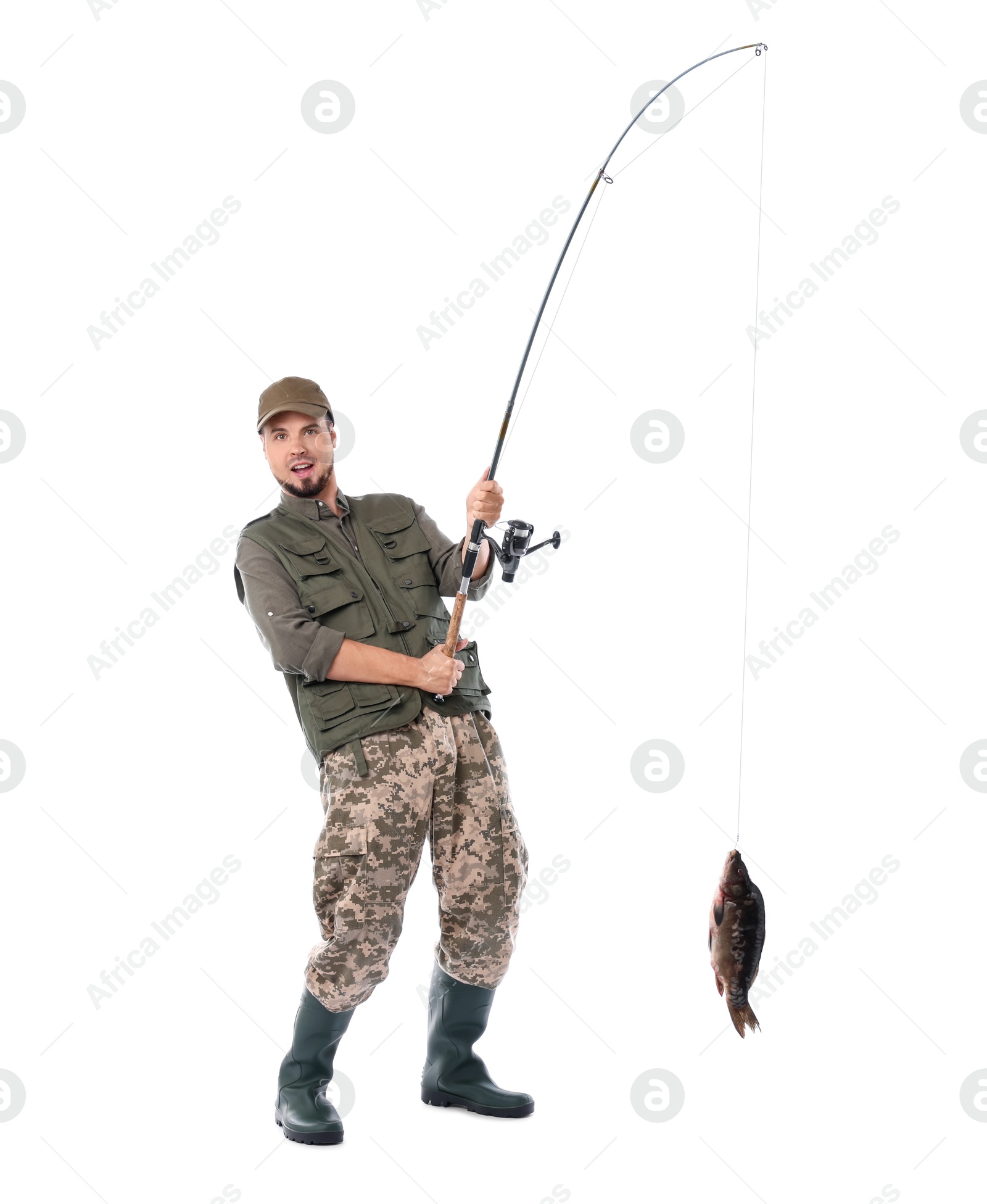 Photo of Emotional fisherman with rod and caught fish isolated on white