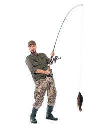 Photo of Emotional fisherman with rod and caught fish isolated on white