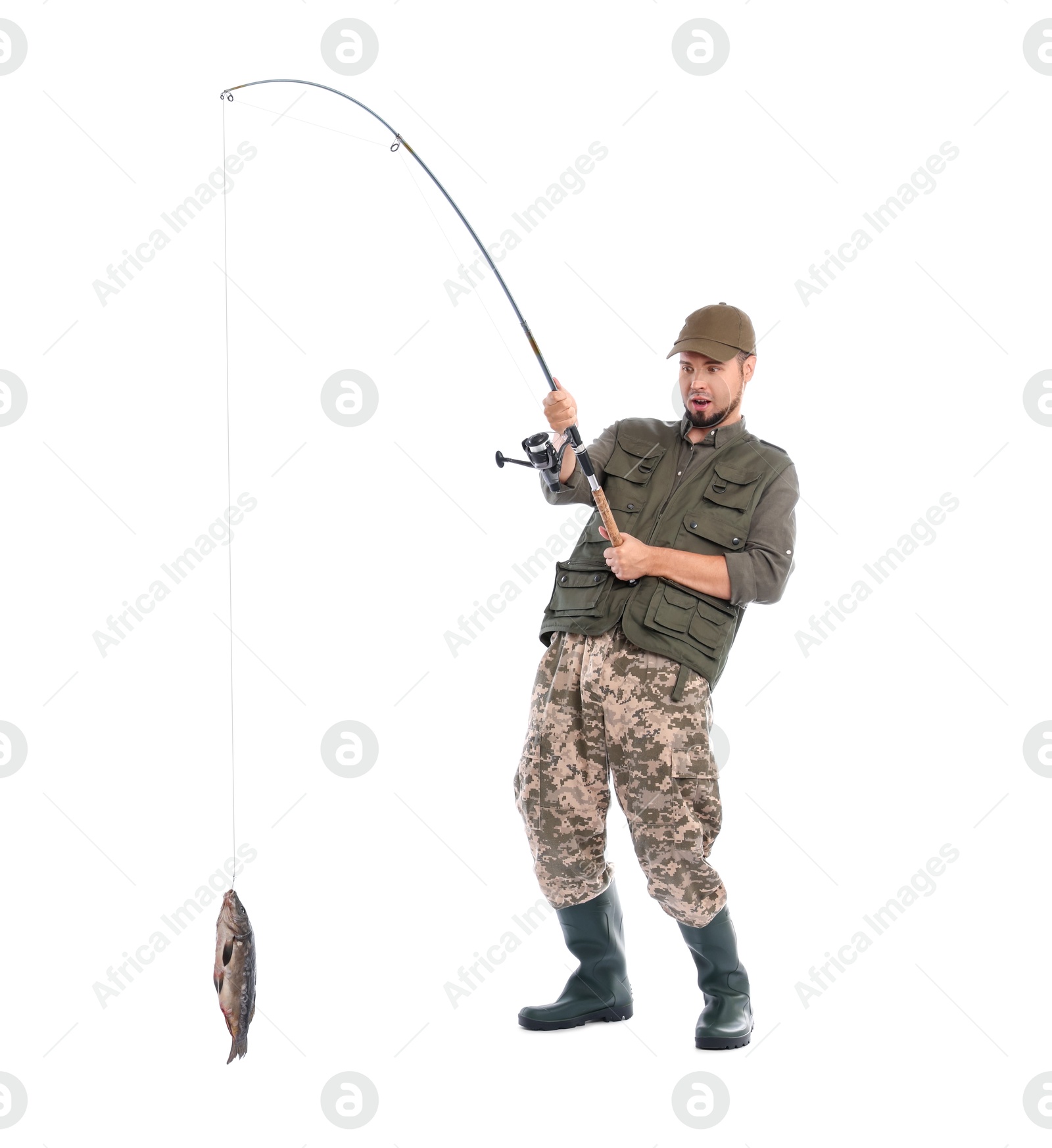 Photo of Emotional fisherman with rod and caught fish isolated on white