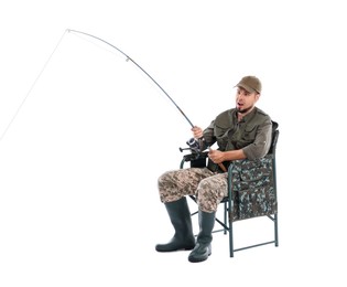 Photo of Emotional fisherman with rod fishing on chair against white background