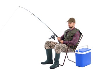 Photo of Fisherman with rod and cooler box fishing on chair against white background