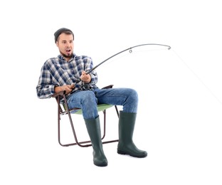 Emotional fisherman with rod fishing on chair against white background