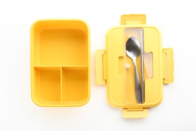 Photo of Plastic lunch box, cutlery and lid isolated on white, top view