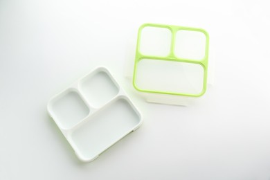 Photo of Plastic lunch box and lid isolated on white, top view