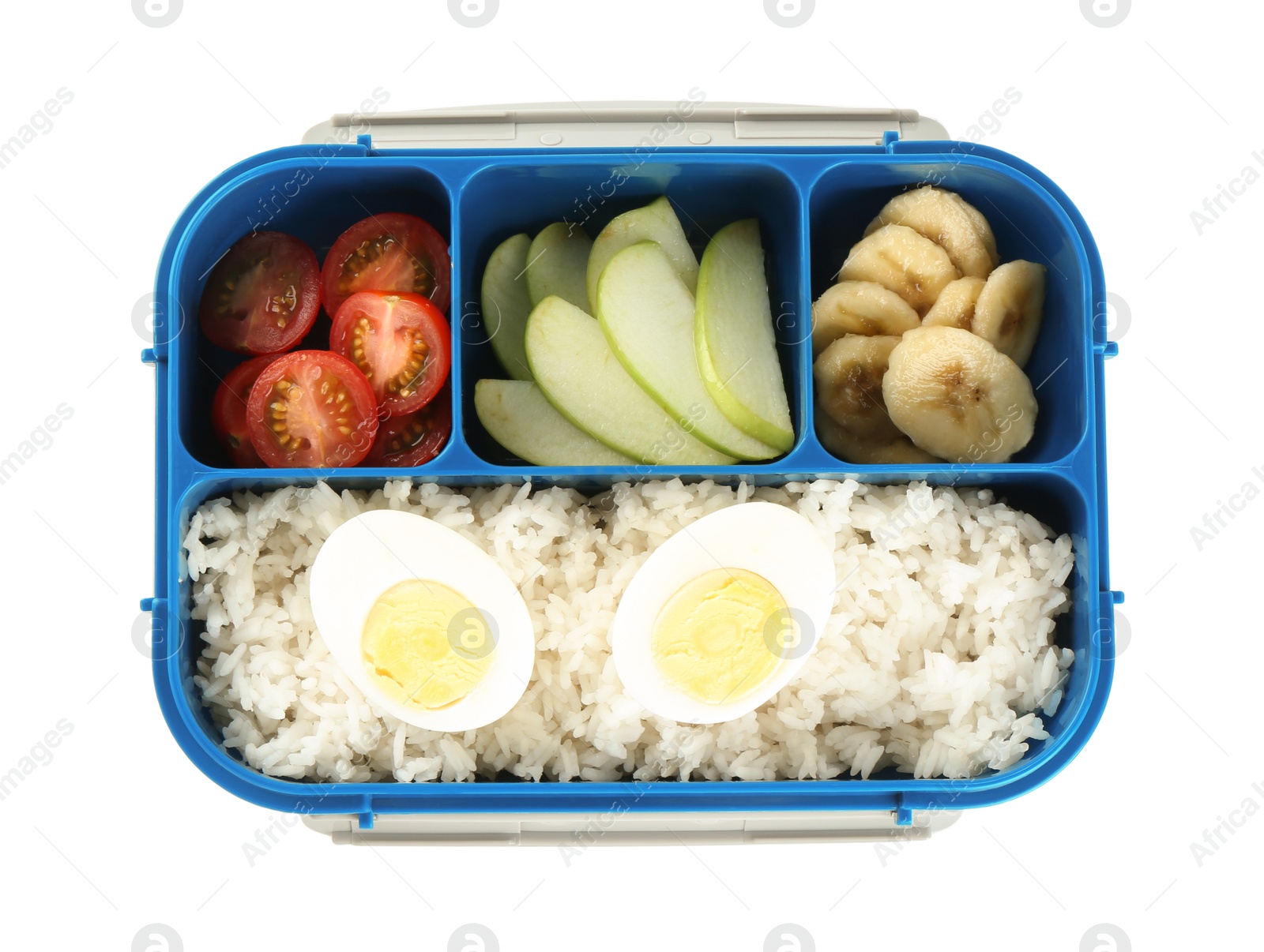 Photo of Lunch box with rice, fruits, tomatoes and egg halves isolated on white, top view