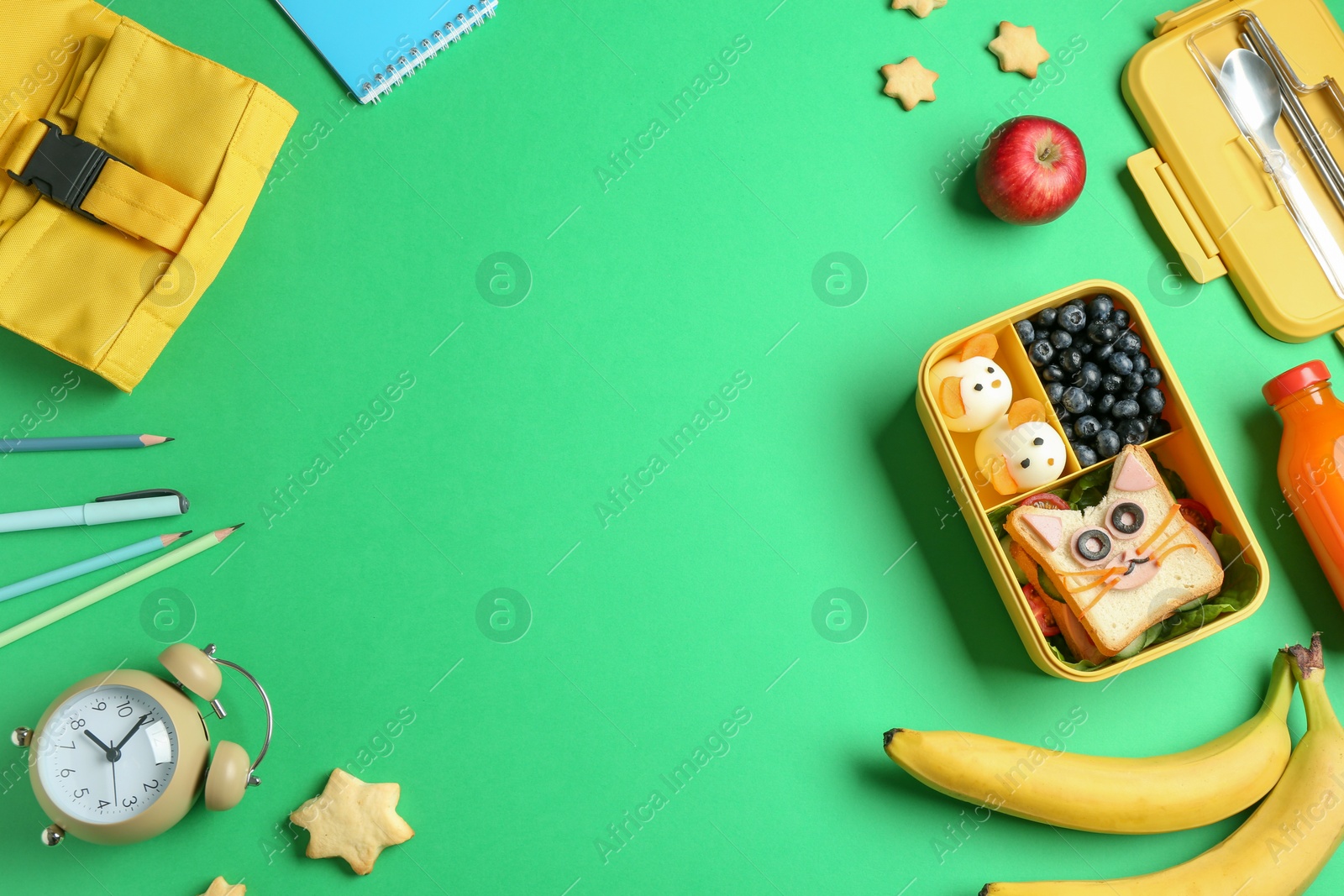 Photo of Flat lay composition with lunch box and snacks on green table, space for text