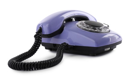 Photo of One violet telephone with handset isolated on white