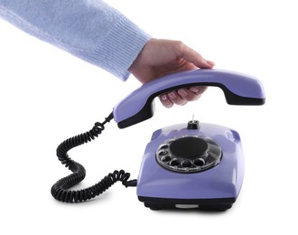 Woman using telephone on white background, closeup