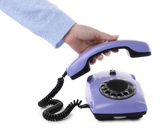 Woman using telephone on white background, closeup