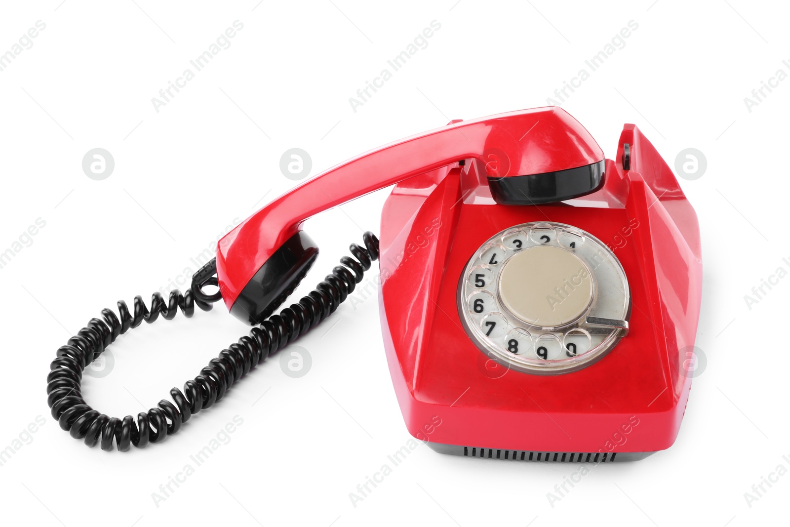 Photo of One red telephone with handset isolated on white