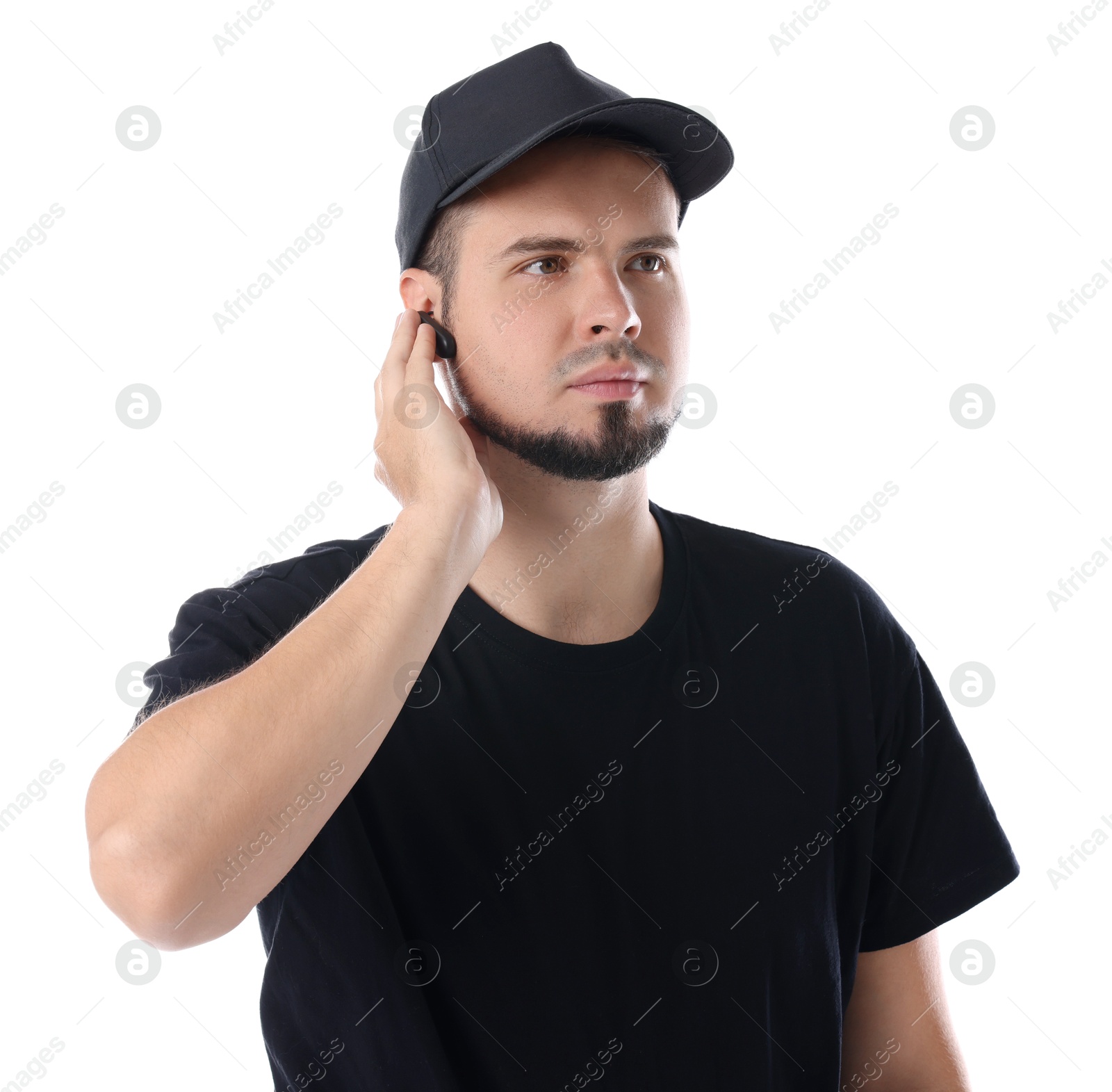 Photo of Young bodyguard with earpiece isolated on white