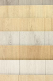 Photo of Many different samples of wooden flooring indoors