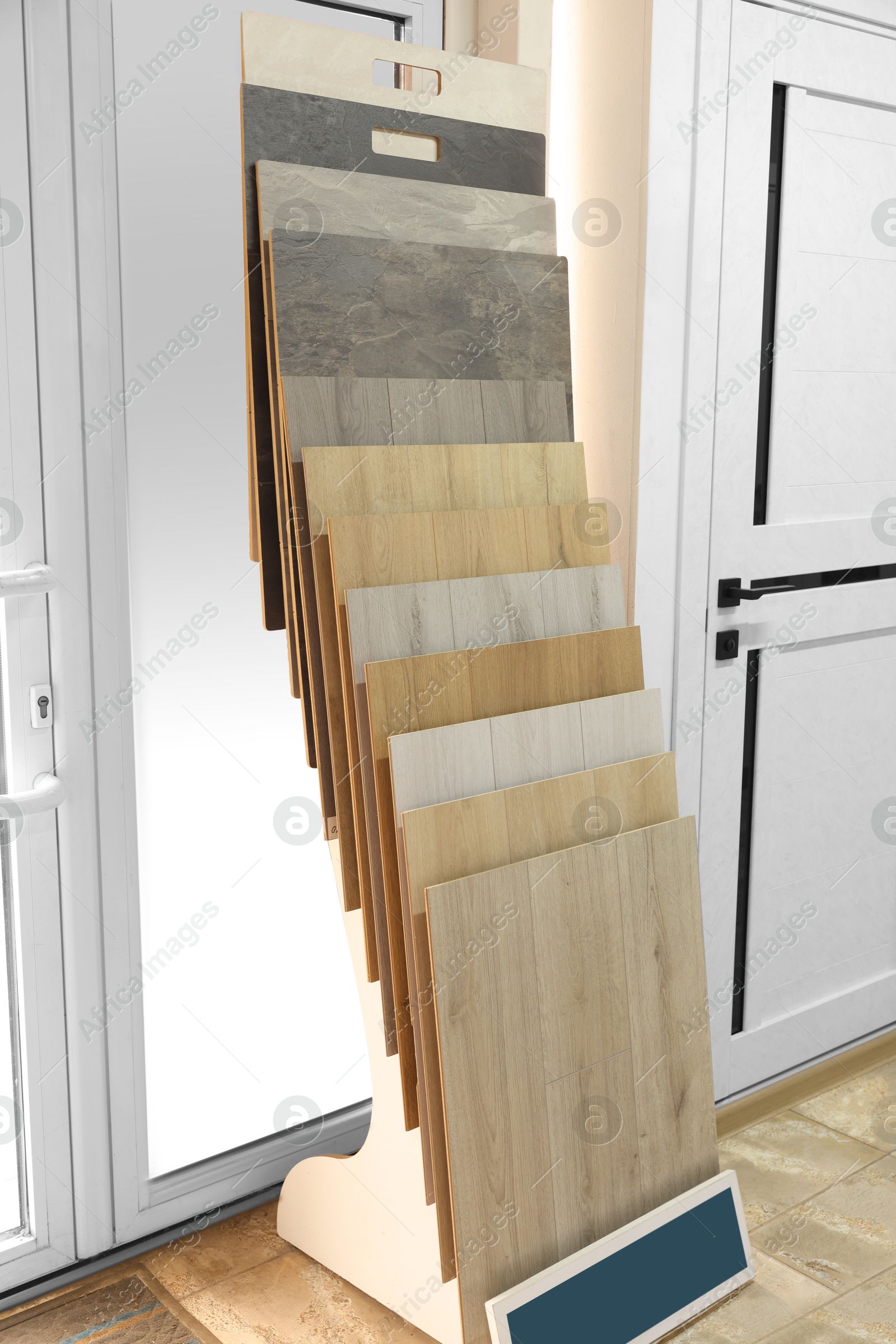 Photo of Many different samples of wooden flooring in store